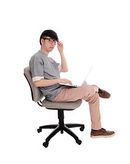 Image showing Asian man typing at his laptop.