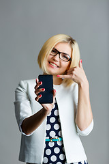 Image showing Blonde with phone shows shaka