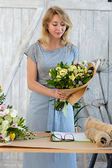 Image showing Long haired blonde with bouquet