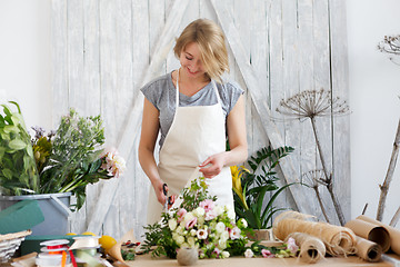 Image showing Florist woman with beautiful bouquet