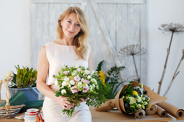 Image showing Portrait of blonde with bouquet