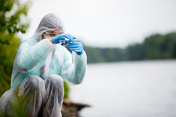 Image showing Laboratory assistant with test tube