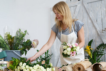 Image showing Photo of woman making bouquet