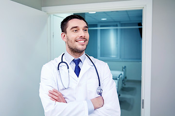Image showing smiling doctor with stethoscope at hospital 
