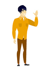 Image showing Young asian businessman waving his hand.