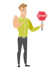 Image showing Caucasian businessman holding stop road sign.