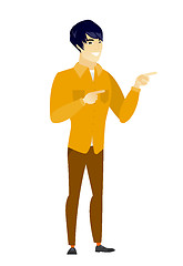 Image showing Young asian businessman pointing to the side.