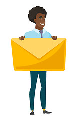 Image showing Smiling businessman holding a big envelope.