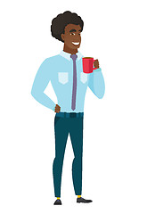 Image showing Young caucasian businessman holding cup of coffee.