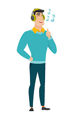 Image showing Businessman listening to music in headphones.