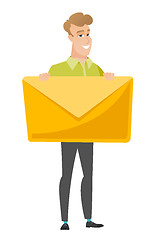 Image showing Smiling businessman holding a big envelope.