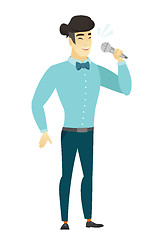 Image showing Asian businessman singing to the microphone.