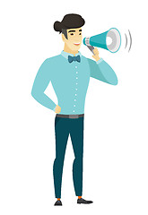 Image showing Asian businessman talking into loudspeaker.