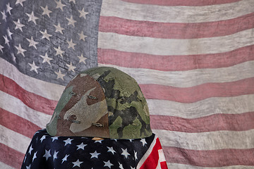 Image showing Old Army Helmet And Flag