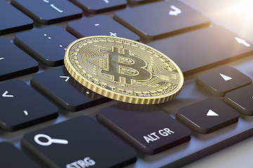 Image showing bitcoin coin on a keyboard