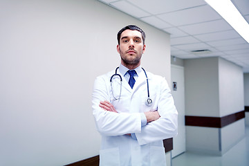 Image showing doctor with stethoscope at hospital corridor