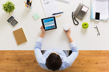 Image showing businesswoman with tablet pc and coffee at office