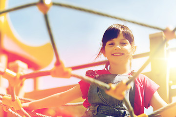 Image showing happy little girl climbing on children playground