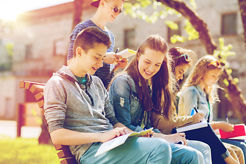 Image showing group of students with notebooks at school yard