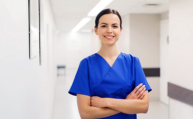 Image showing happy doctor or nurse at hospital corridor