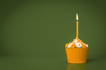 Image showing orange cupcake with a candle