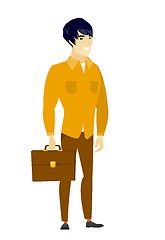 Image showing Asian business man holding briefcase.