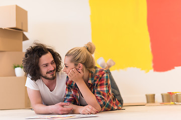 Image showing Happy young couple relaxing after painting