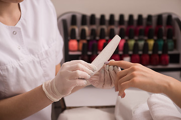 Image showing Woman hands receiving a manicure