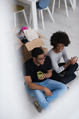 Image showing African American couple relaxing in new house