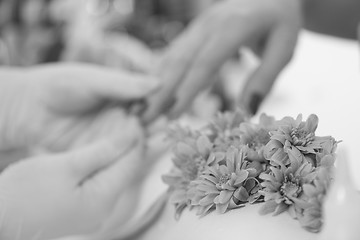 Image showing Woman hands receiving a manicure