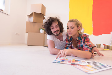 Image showing Happy young couple relaxing after painting