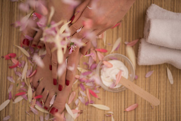 Image showing female feet and hands at spa salon