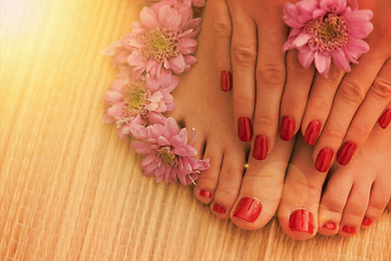 Image showing female feet and hands at spa salon