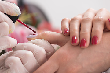 Image showing Woman hands receiving a manicure