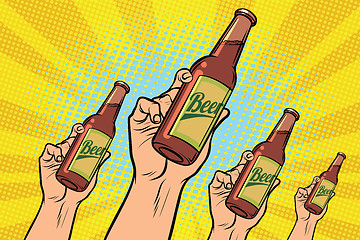 Image showing many hands with a bottle of beer