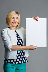 Image showing Photo of model with paper