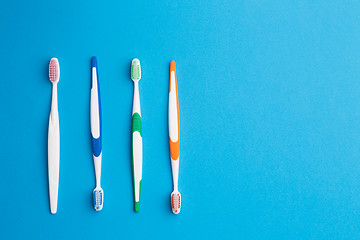 Image showing Multicolored toothbrushes with blank space