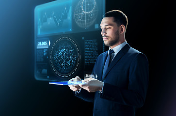 Image showing businessman in suit with transparent tablet pc