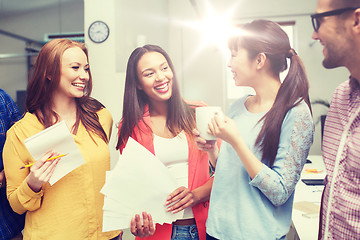 Image showing creative team on coffee break talking at office