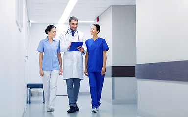 Image showing group of medics at hospital with clipboard