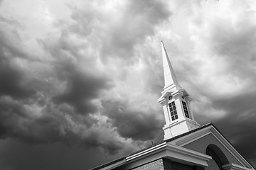 Image showing Black and White Church Steeple Tower Below Ominous Stormy Thunde