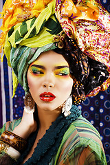 Image showing beauty bright woman with creative make up, many shawls on head l