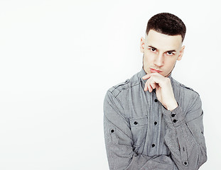 Image showing young handsome teenage hipster guy posing emotional, happy smiling against white background isolated, lifestyle people concept 