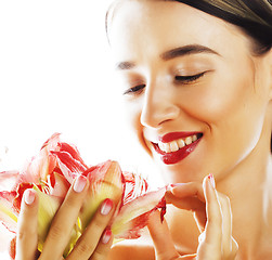 Image showing young pretty brunette woman with red flower amaryllis close up i