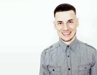 Image showing young handsome teenage hipster guy posing emotional, happy smiling against white background isolated, lifestyle people concept 