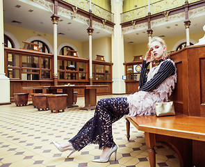 Image showing young attractive fashion lady on railway station waiting, vintag