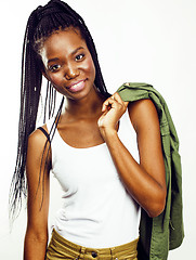 Image showing young pretty african-american girl posing cheerful emotional on white background isolated, lifestyle people concept 
