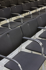 Image showing Black chairs in a row