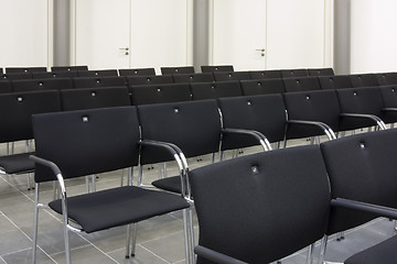 Image showing Black chairs in a row