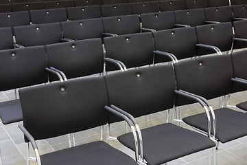 Image showing Black chairs in a row